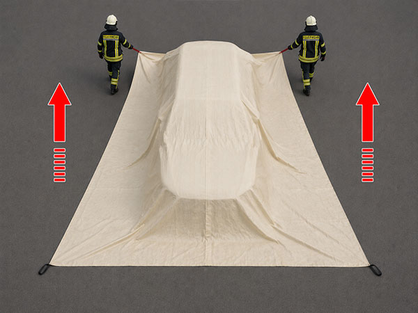 Pull the S-TYPE EV Car Fire Blanket completely over an electric vehicle