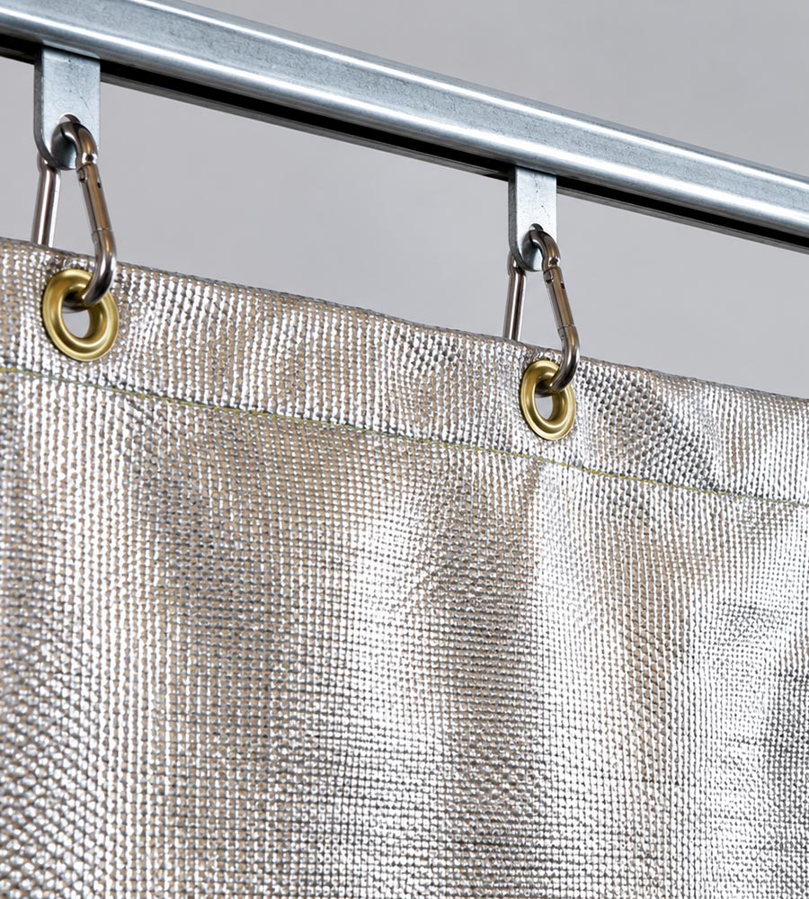Heat protection curtain with reflective aluminium surface for shielding intense radiant heat