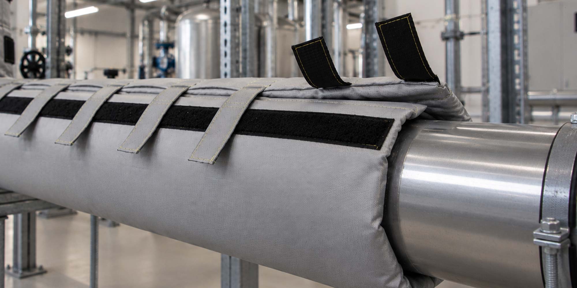 Custom removable pipe insulation for industrial piping with elbows flanges and valves